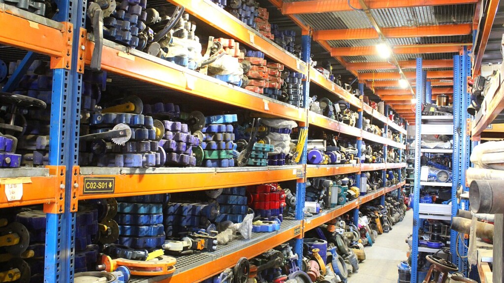 Shelves filled with colorful industrial motors and pumps