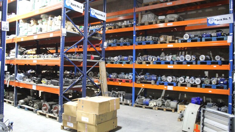 Professional warehouse with numbered racks and organized motors