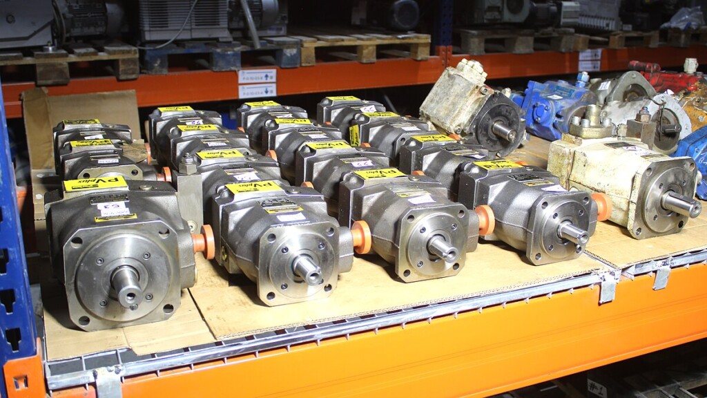 Neatly arranged hydraulic pumps showing new condition industrial parts