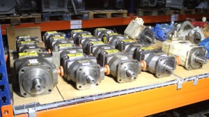 Neatly arranged hydraulic pumps showing new condition industrial parts